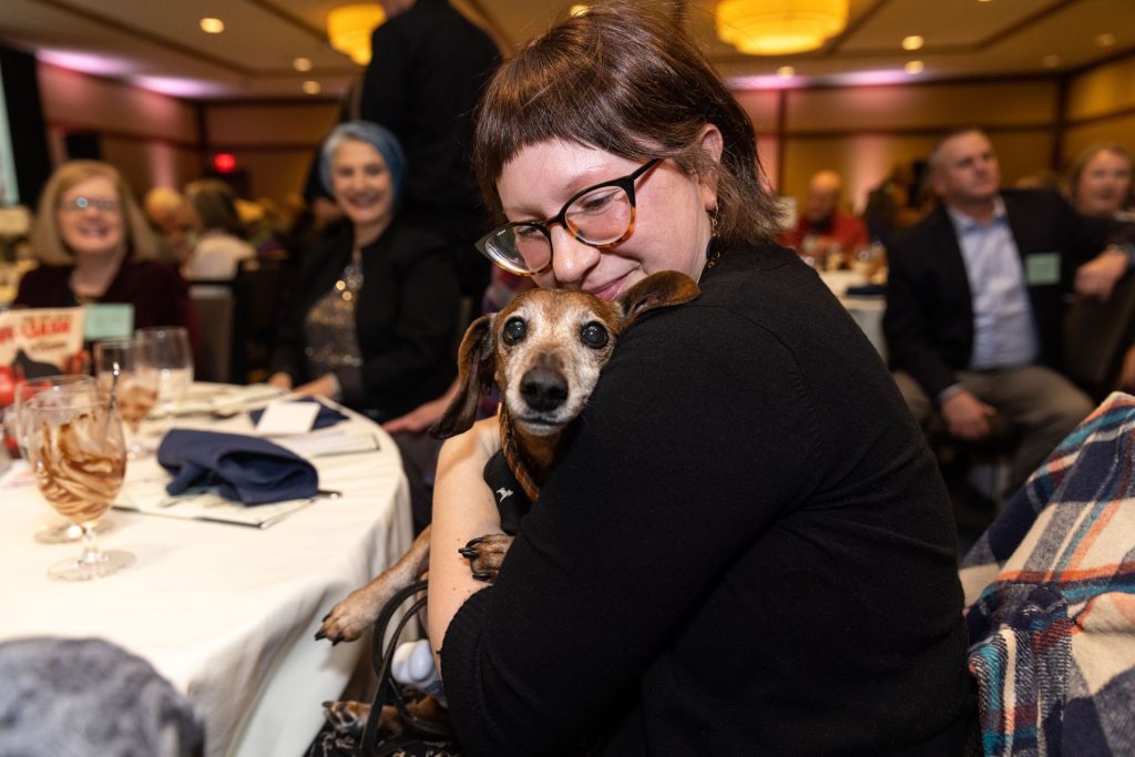 Rusty the dog getting love from owner at 2023 OHS Diamond Collar awards