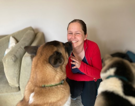 Oregon Humane Trainer Paulina Tehran posing with her dogs