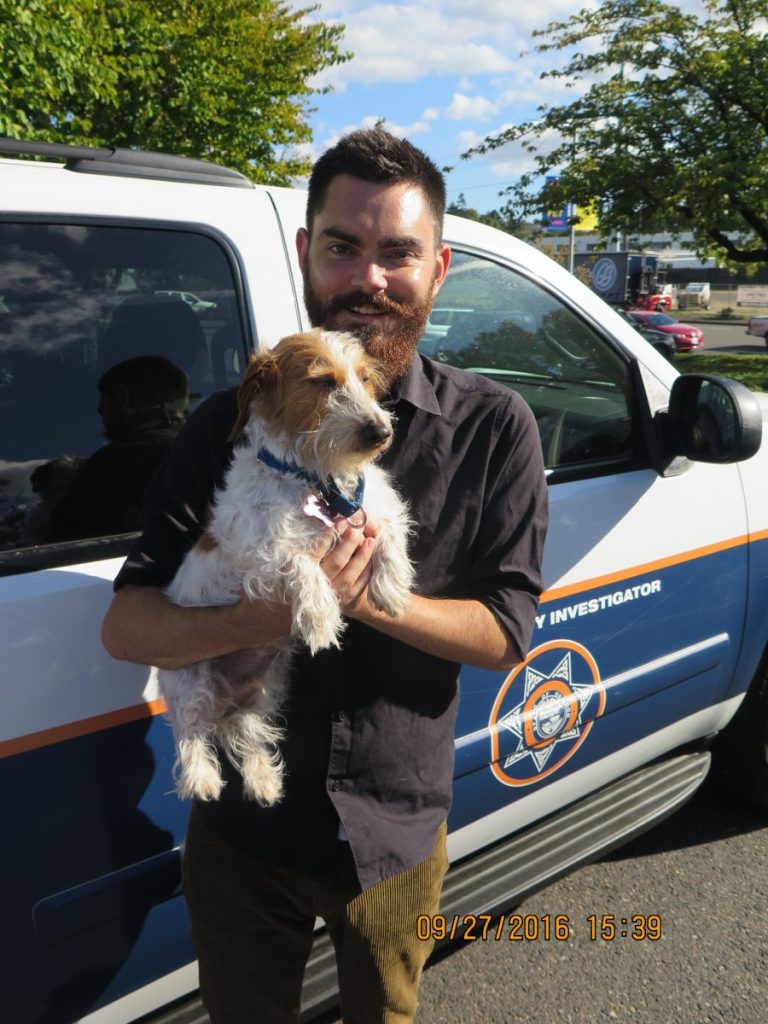 John and Baxter, a dog helped by the Oregon Humane Investigations Department.